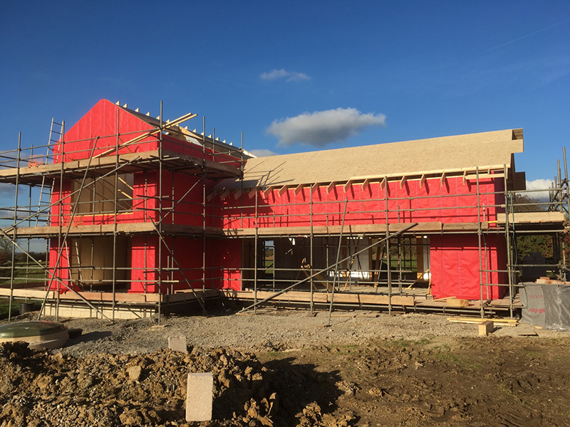 a timber frame home under construction