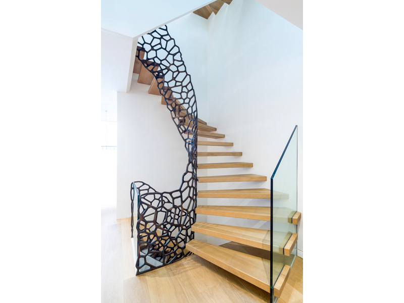 Cells staircase system with antique bronze balustrade, glass risers and the glass balustrade to the lower steps (eestairs.co.uk)