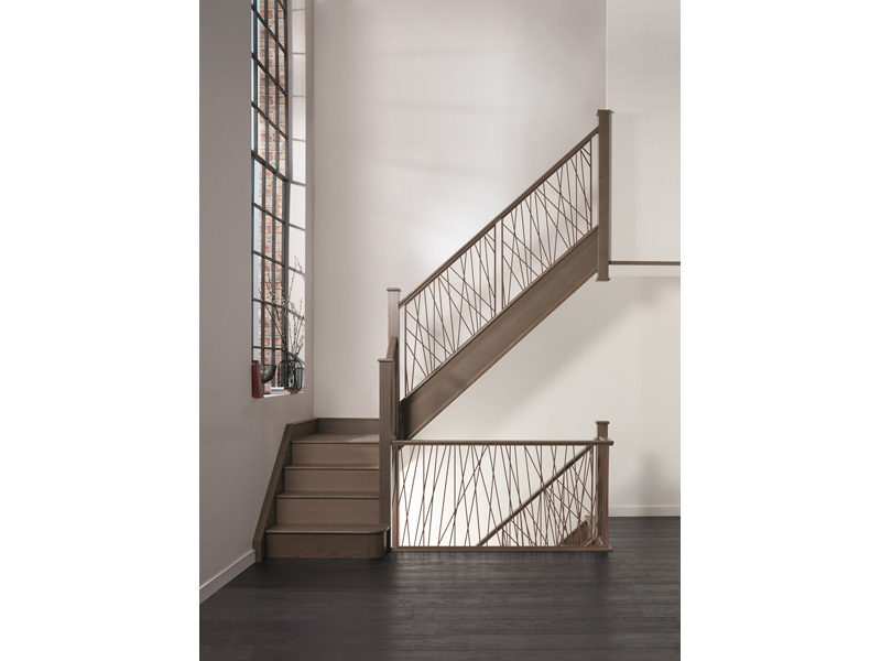 Opus staircase strong steel spindles and set into a solid wooden base (nevillejohnson.co.uk)