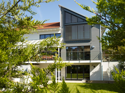 Baufritz house with basement built into a sloping site